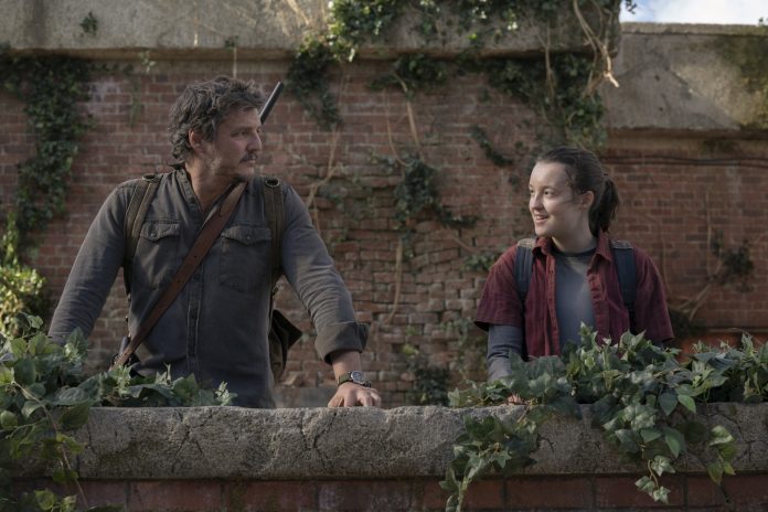 Smiling pair standing outdoors.