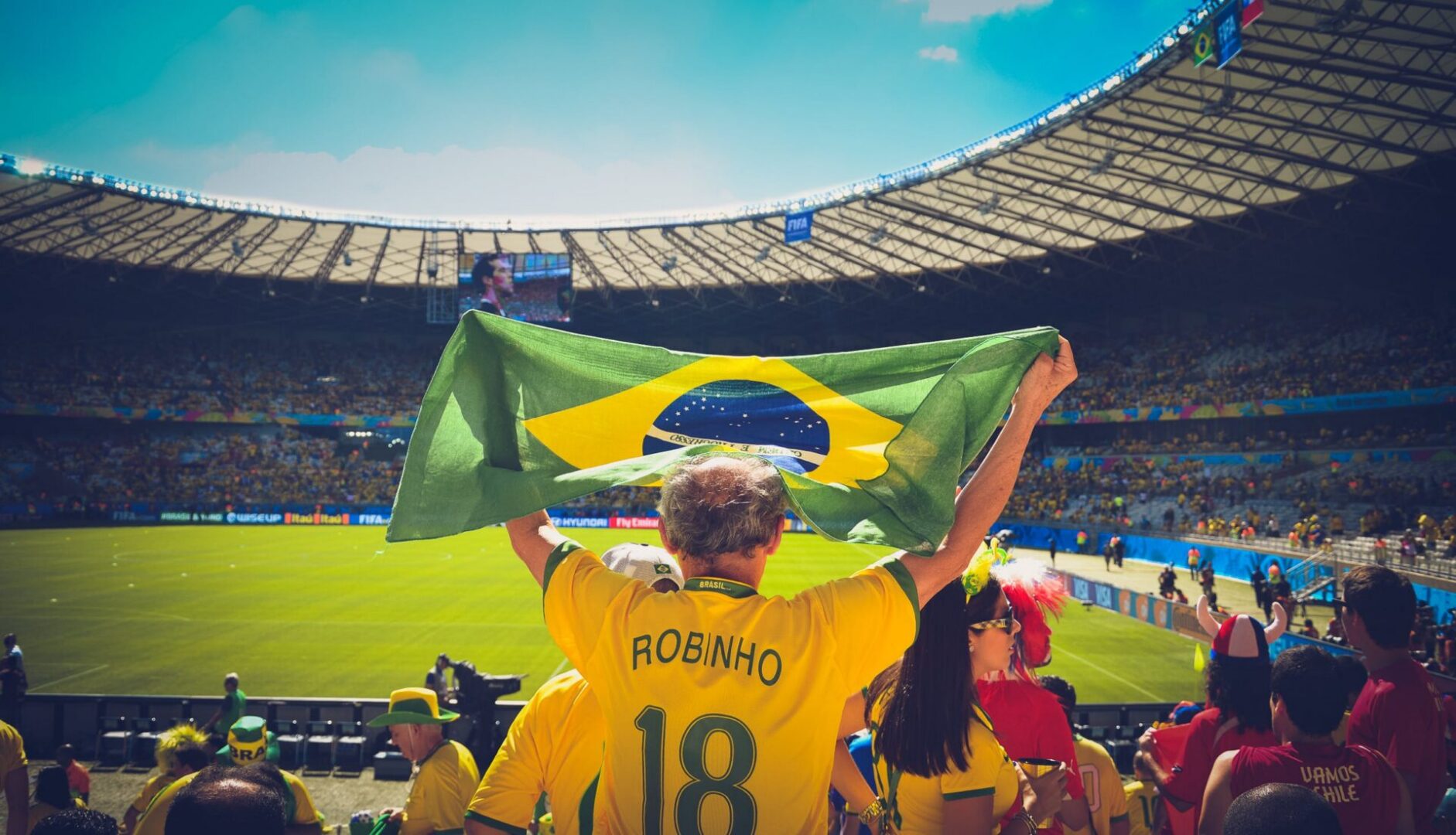 Man in yellow jersey at football game
