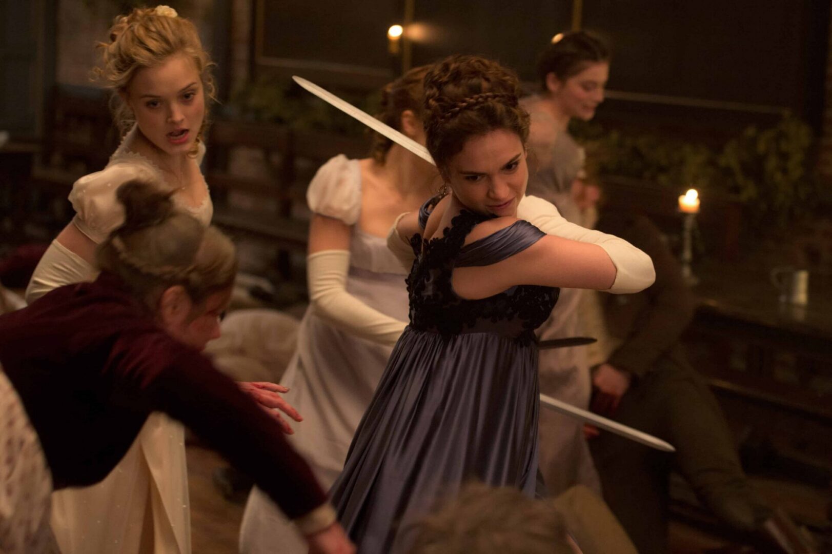 Women fighting with swords in period costumes.
