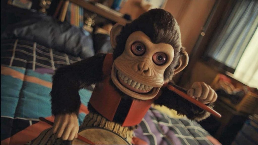 Creepy cymbal-banging monkey toy close-up