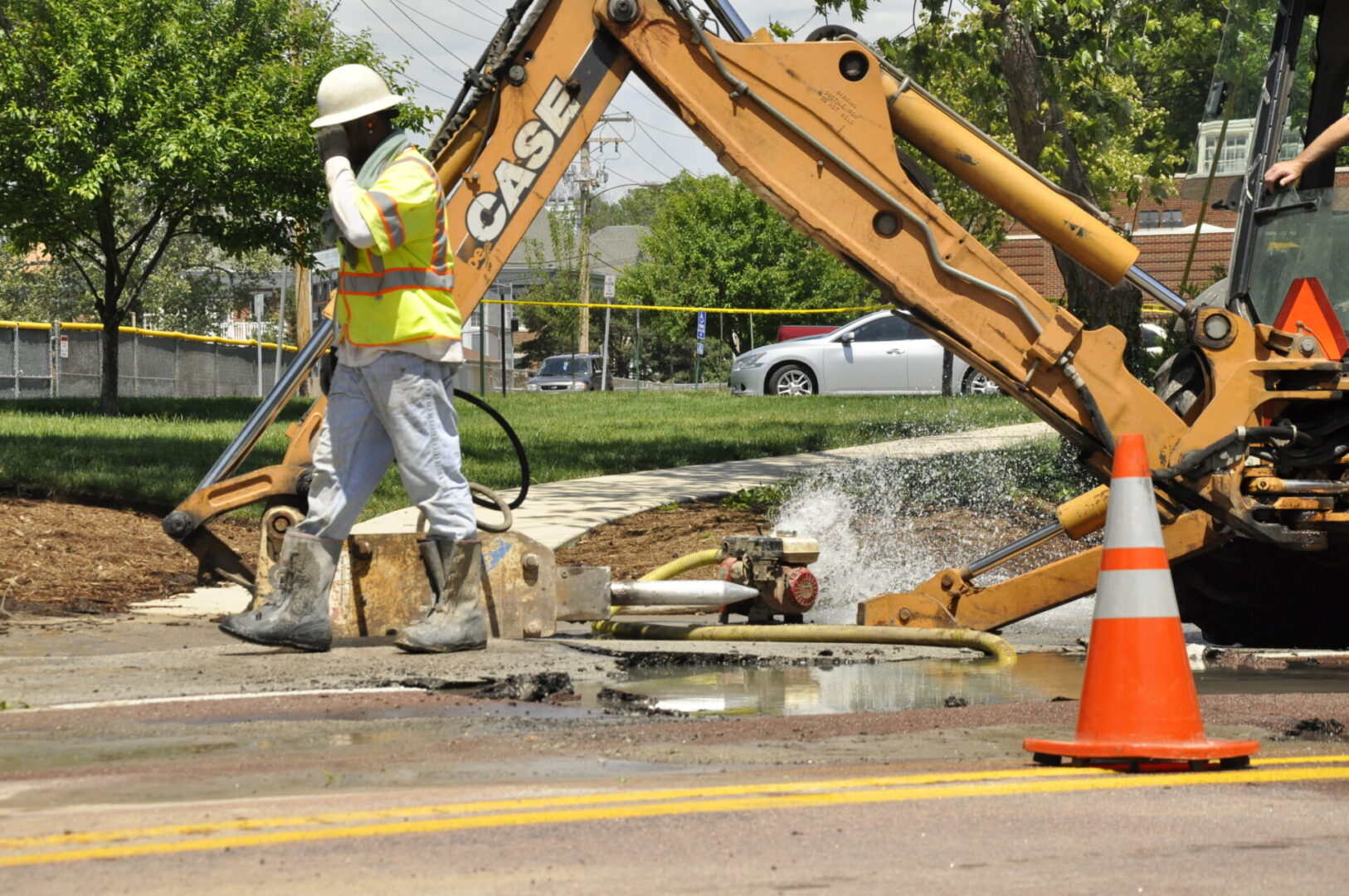 Road repair with machinery and water spray