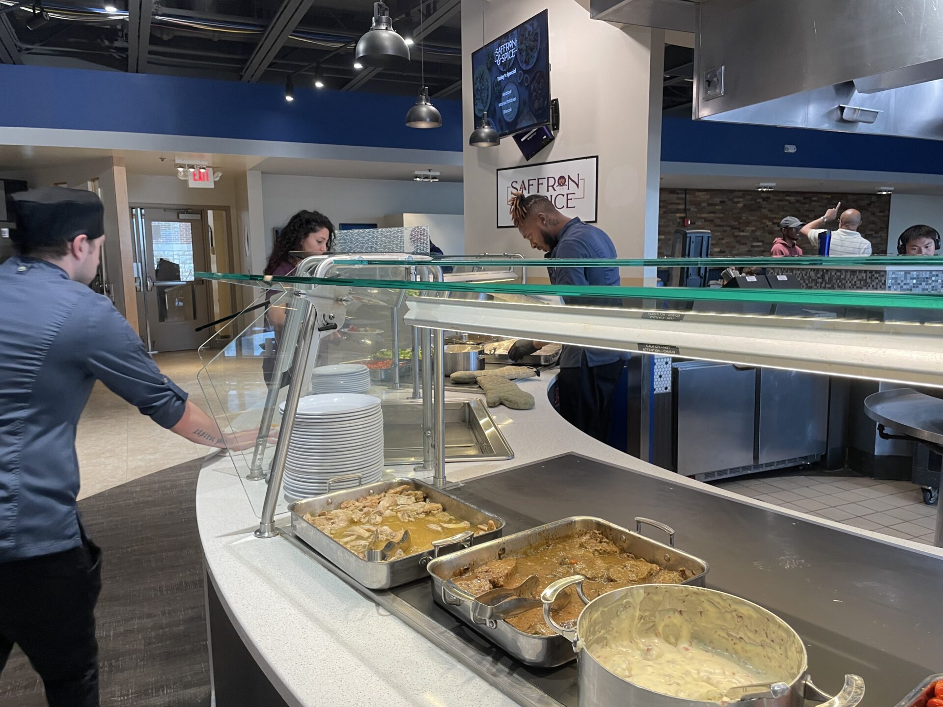 Saffron & Spice, a completely Halal dining option, serves food to a customer during lunch. Photo by Emma Sprung
