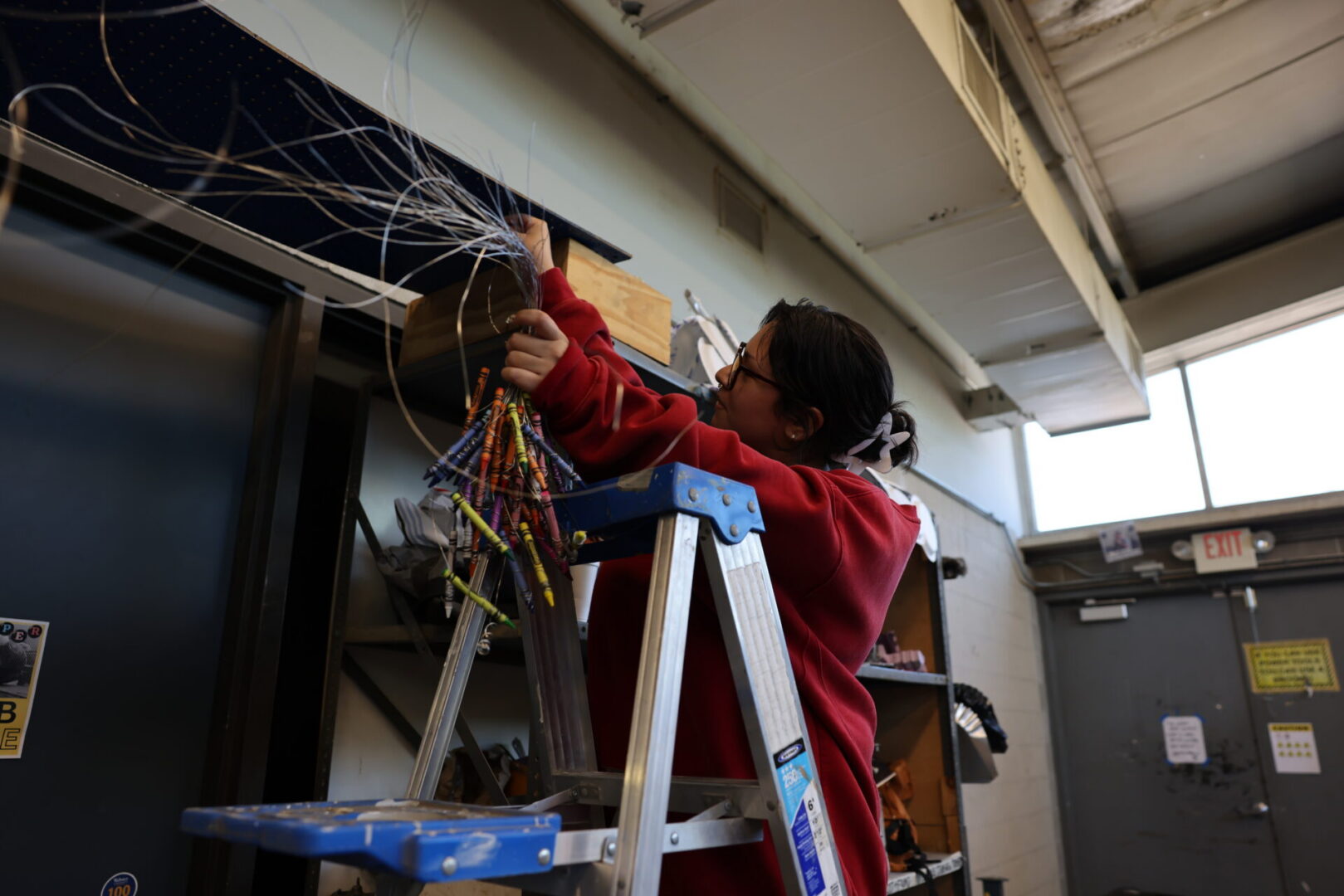 Edén Magaña López working on her art
