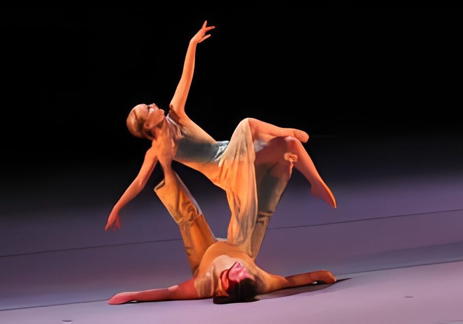 Dancers performing a graceful acrobatic routine