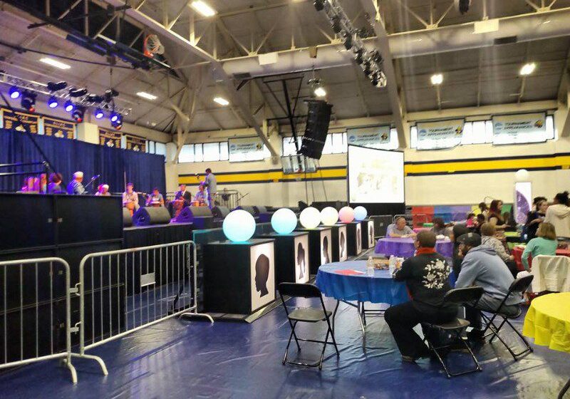 People attending a musical performance indoors.