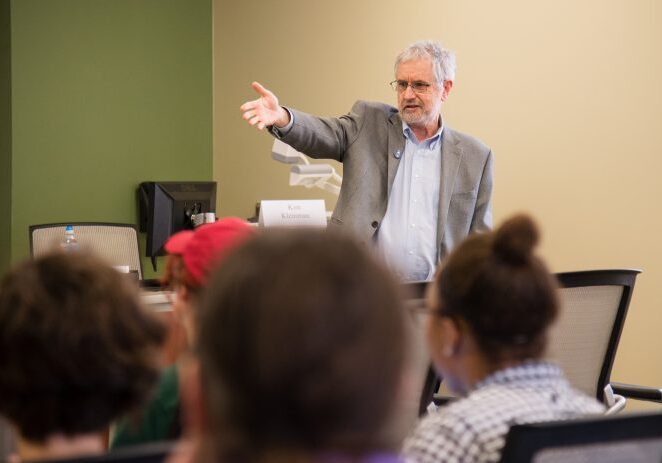 Man presenting to seated audience