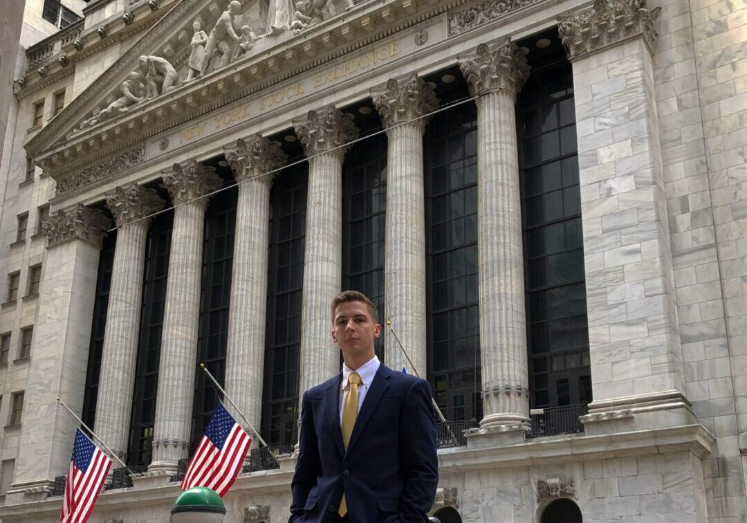 Businessman in front of stock exchange