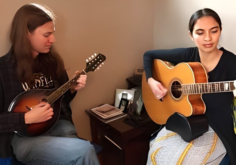 Acoustic duo performing in a cozy room