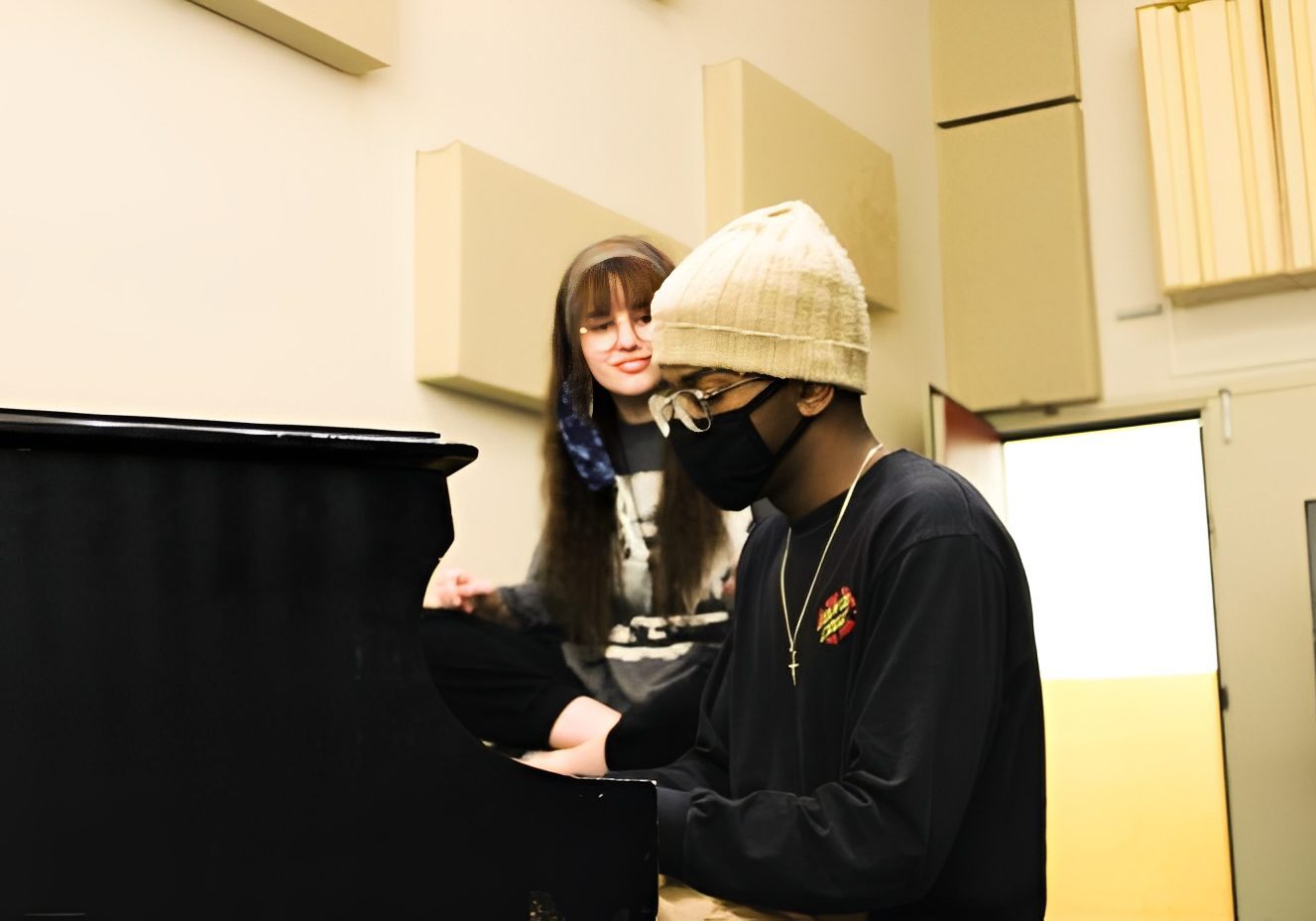 Musician playing piano in studio