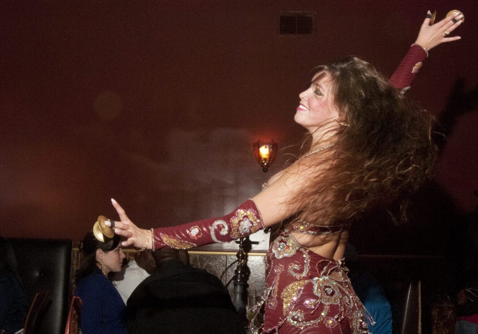 Vibrant dance performance at a dimly lit venue