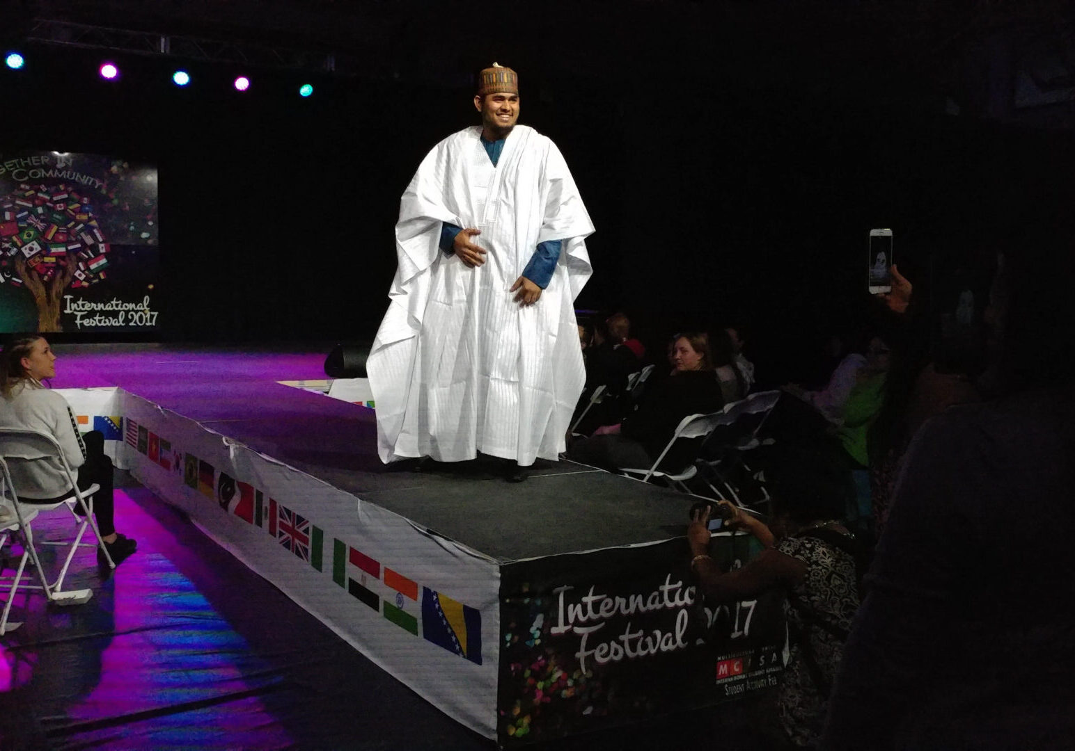 Model on stage at festival