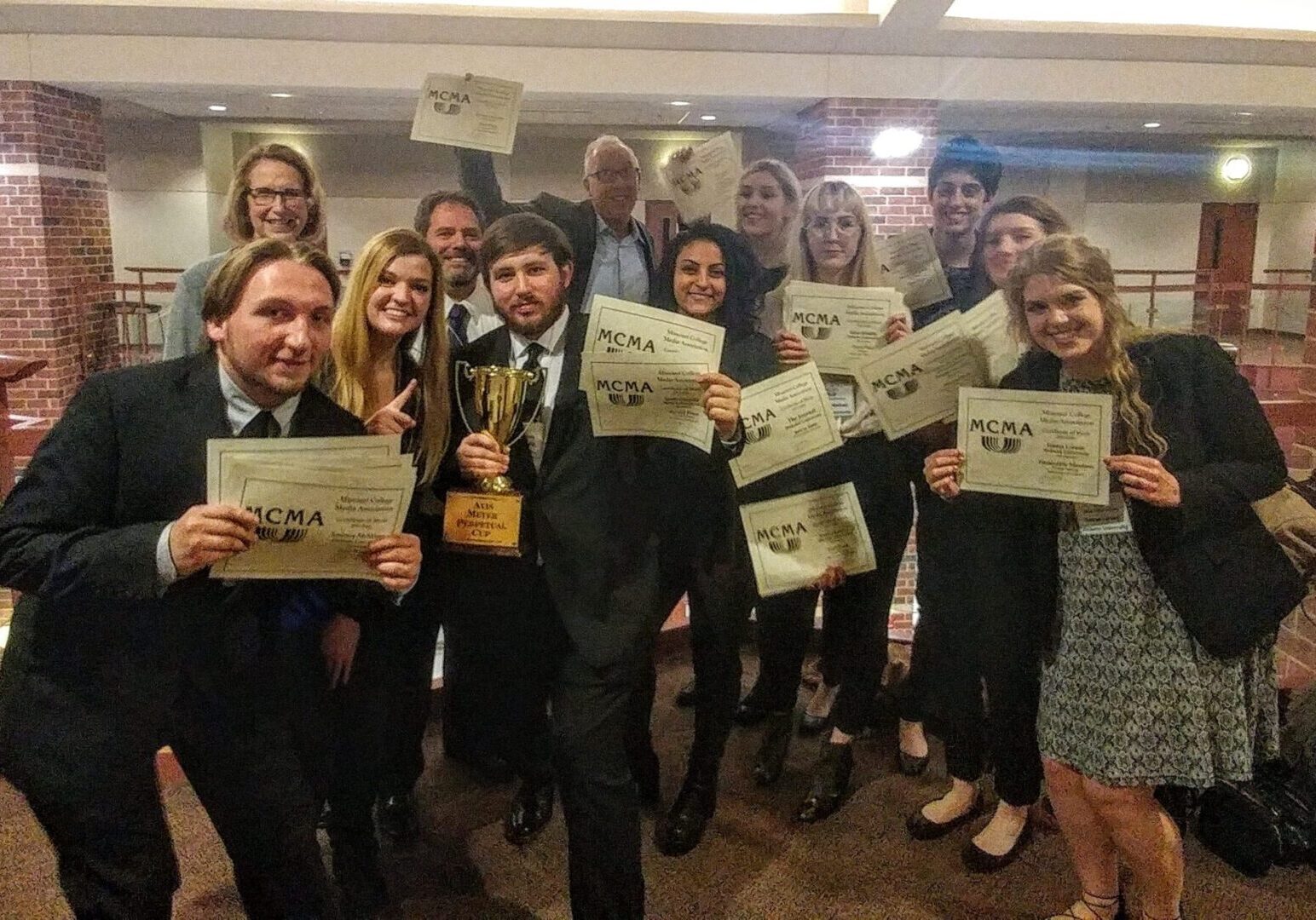 Award-winning group displaying achievements