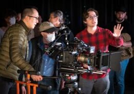 Filmmakers collaborating on set