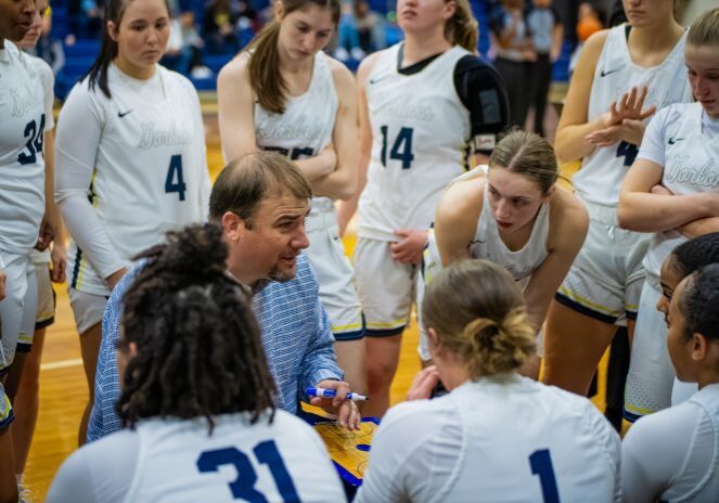 Players listening intently to coach