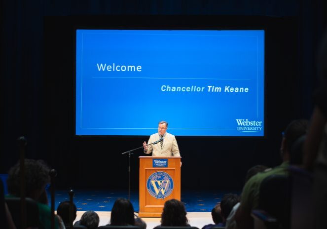 Speaker addressing audience at event
