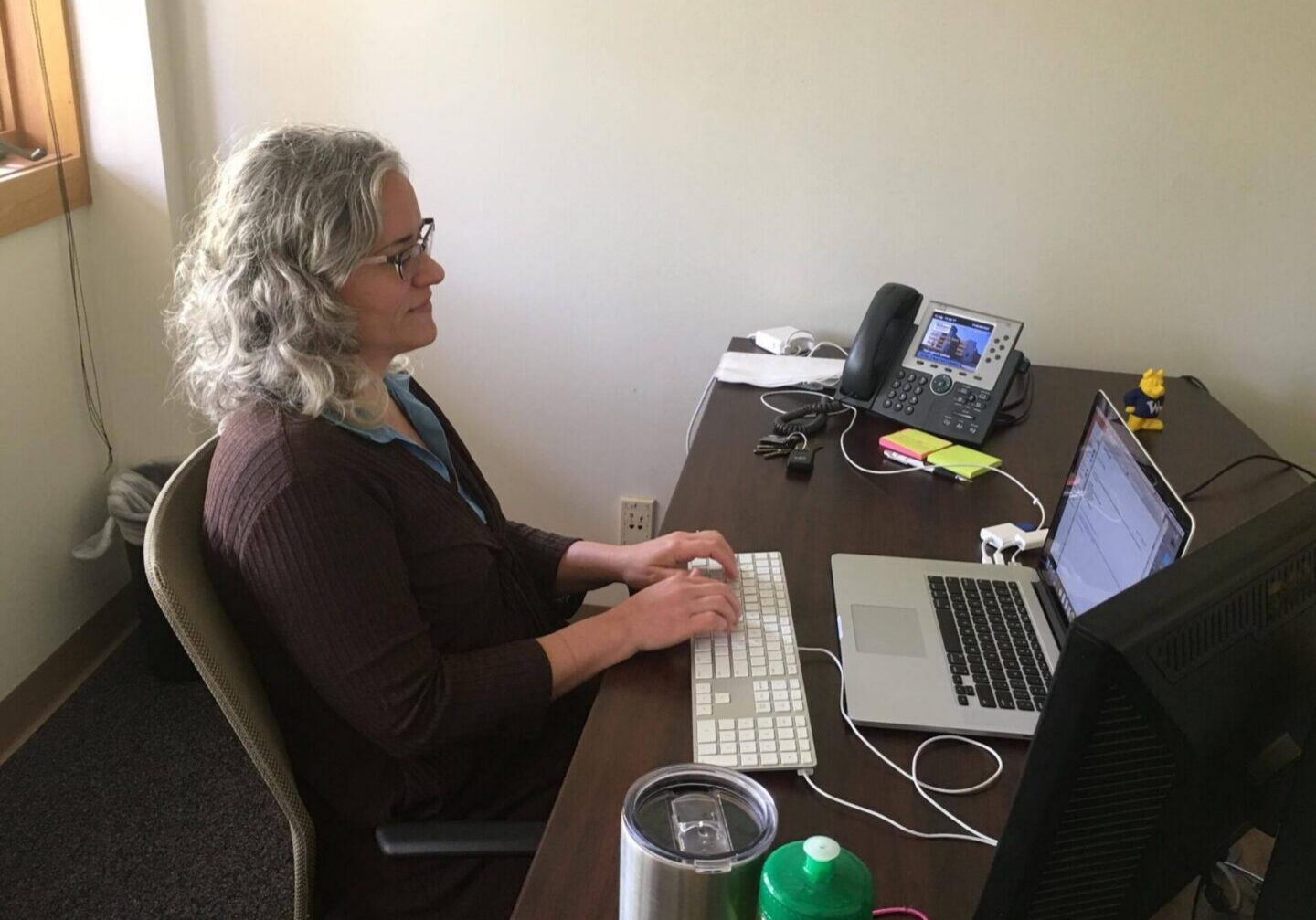 Person using computer in office setting