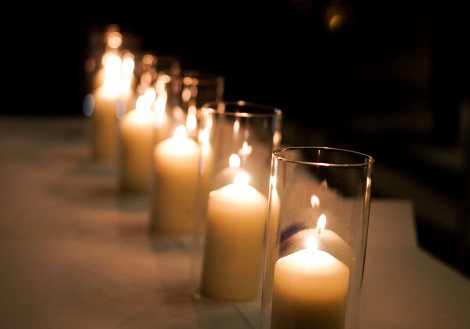 Candles glowing in glass holders