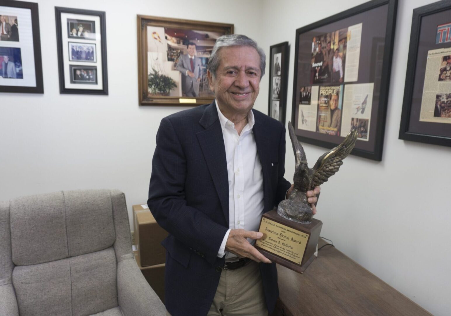 Man holding an eagle trophy