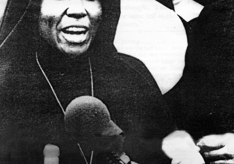Nun speaking at a press conference