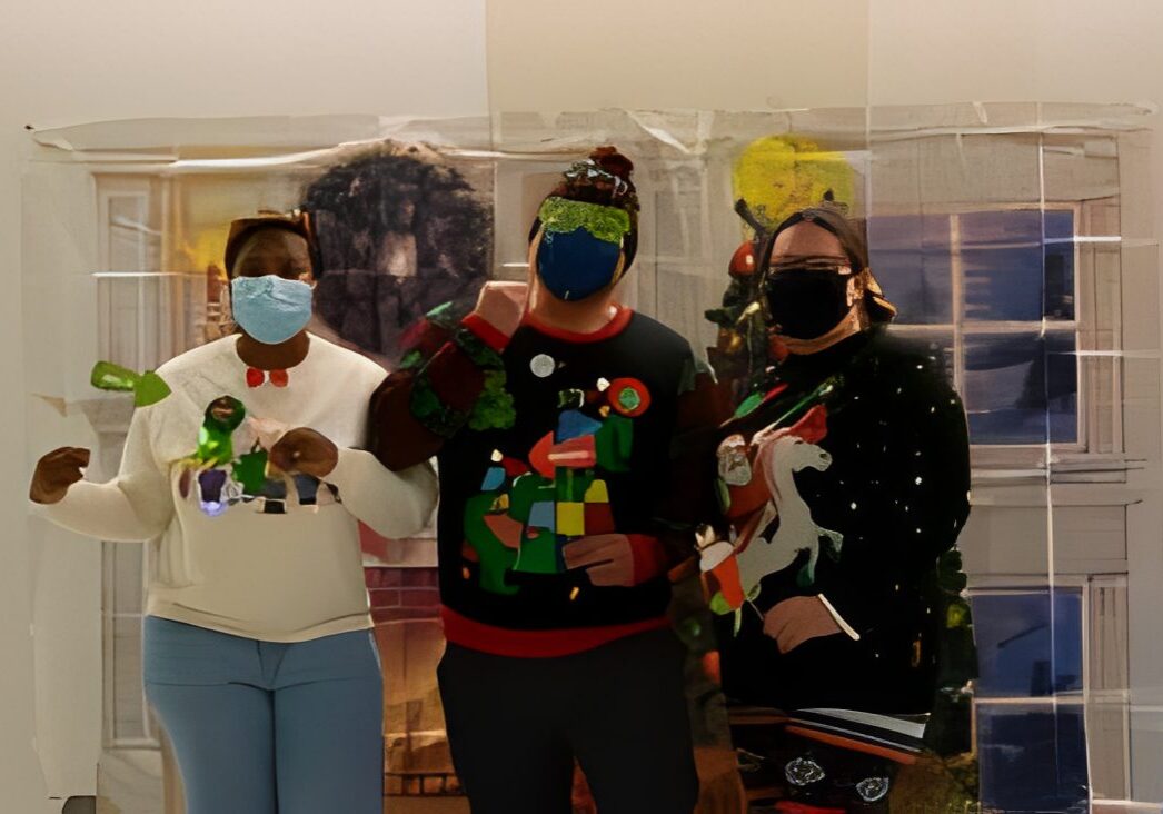 Three people in holiday sweaters
