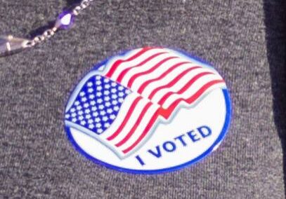 Patriotic sticker with American flag design.