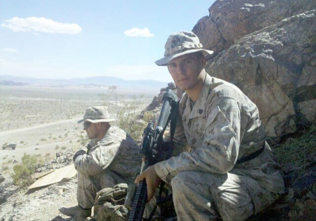 Military personnel with rifles outdoors