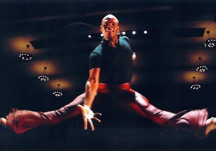 Athlete executing a mid-air split jump