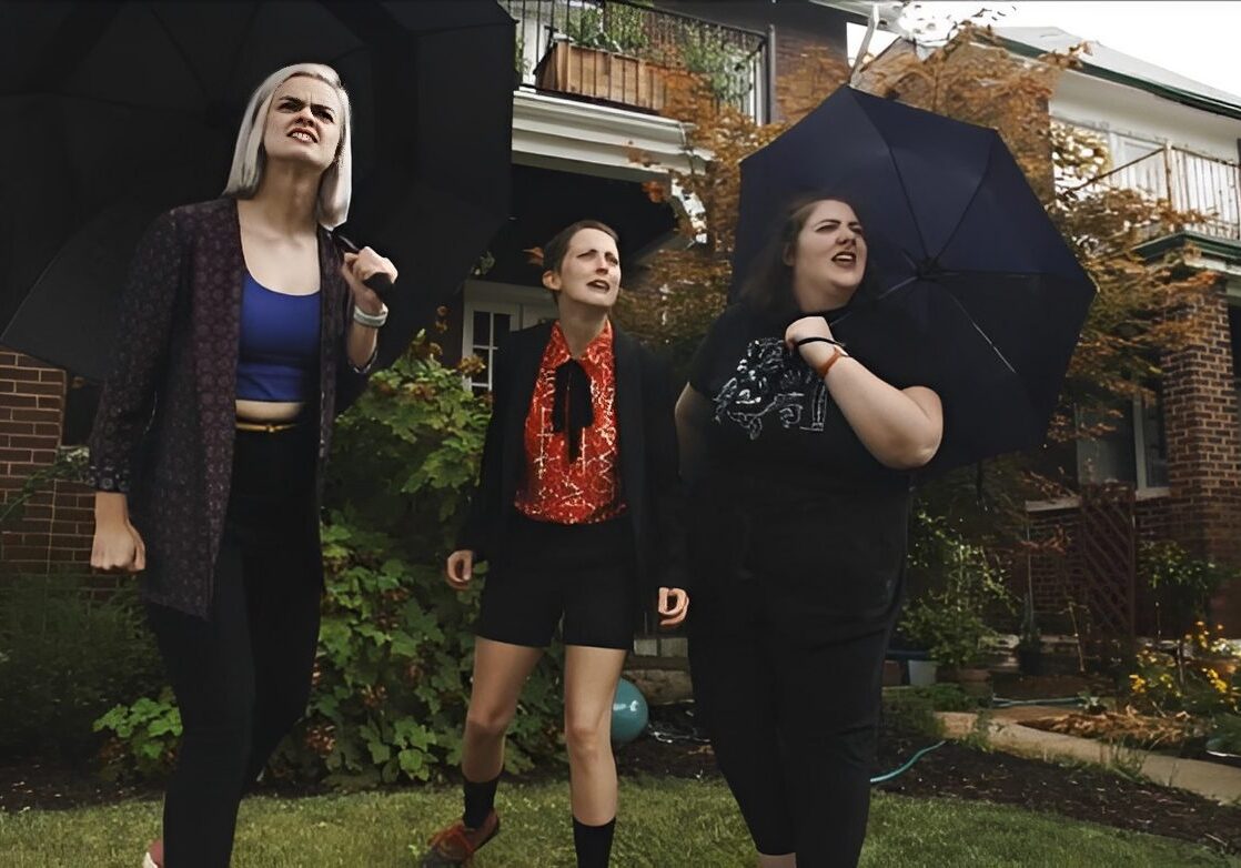 Group of women with black umbrellas