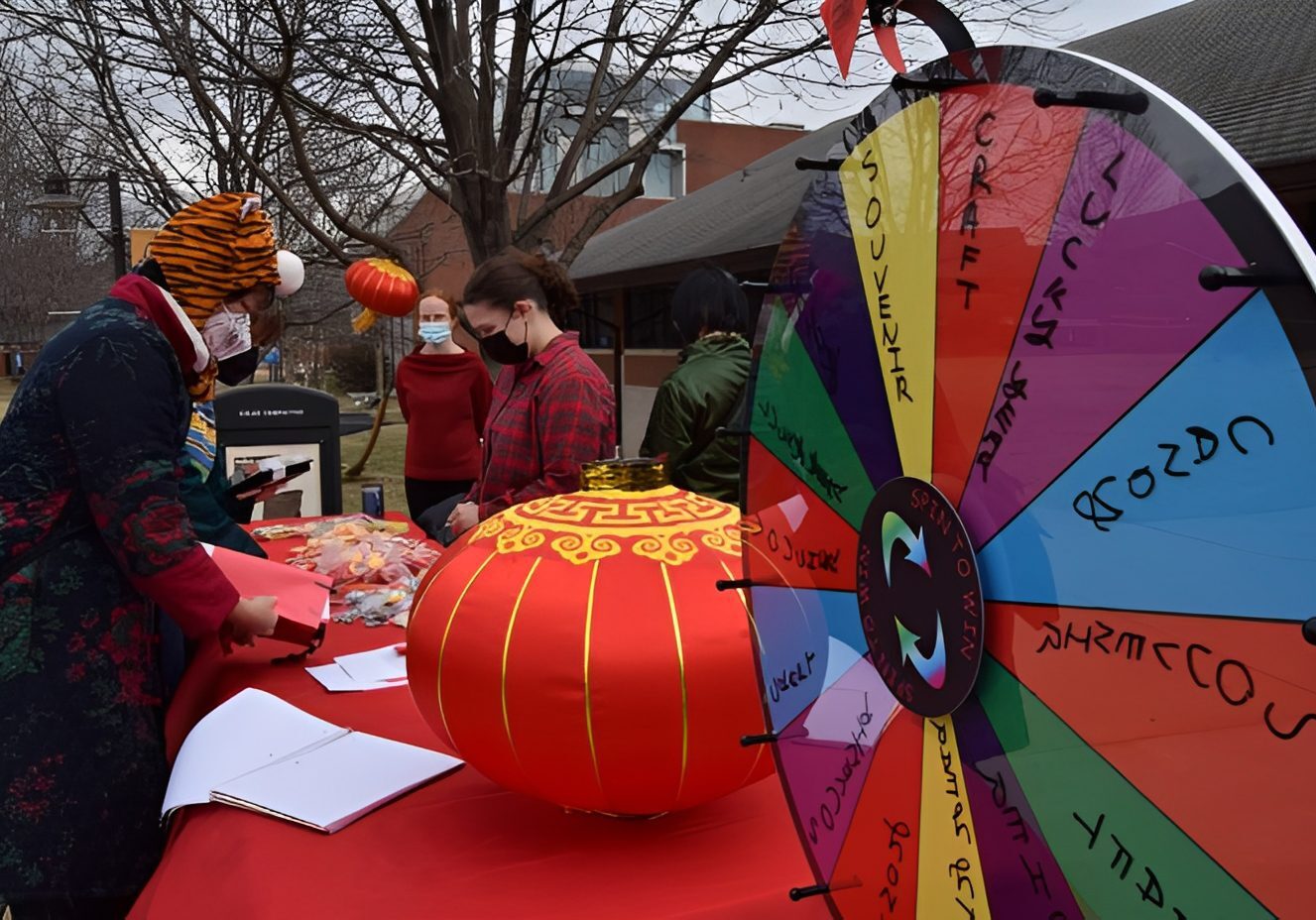 Festive outdoor event with prize wheel