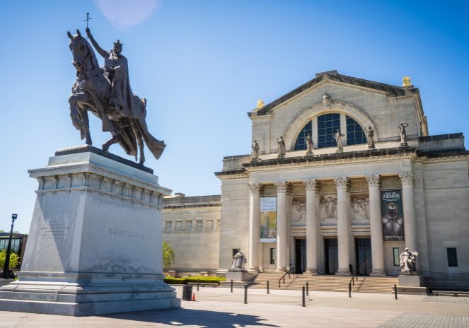 Equestrian statue near historic building entrance
