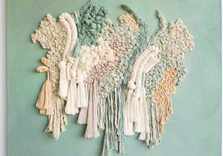 Abstract woven wall hanging with tassels