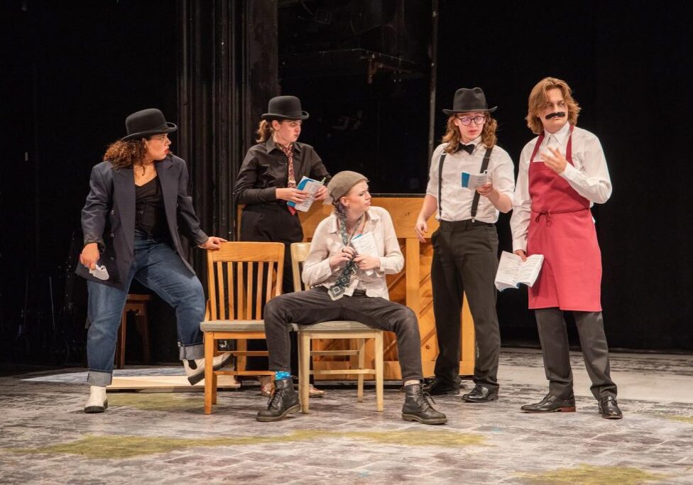 Five people acting in a play