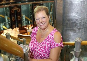Woman posing in industrial-themed setting
