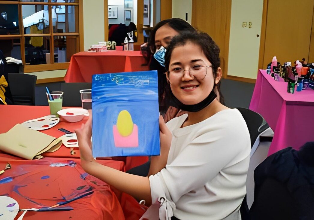 Person holding a colorful painting