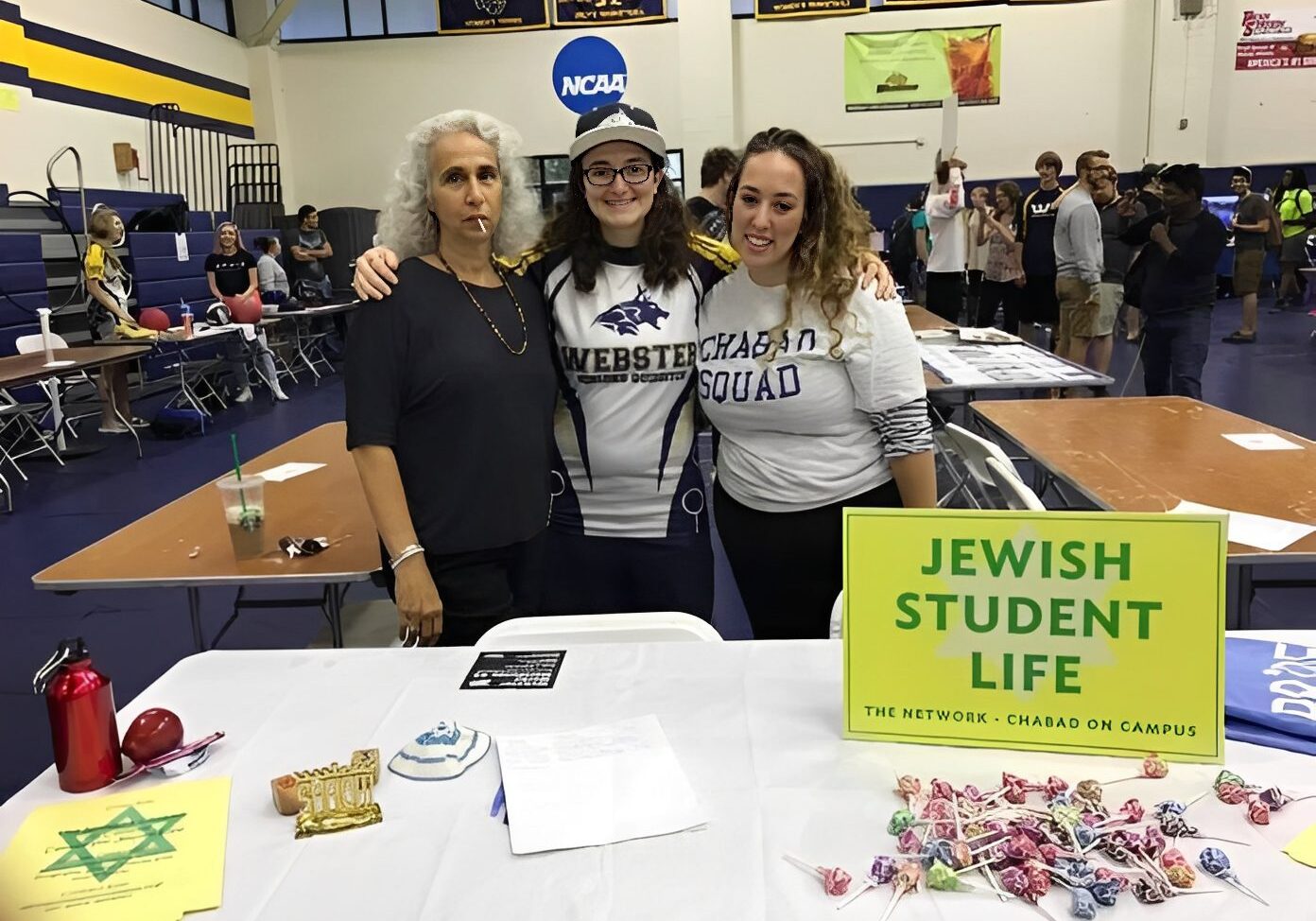 Students at campus event table