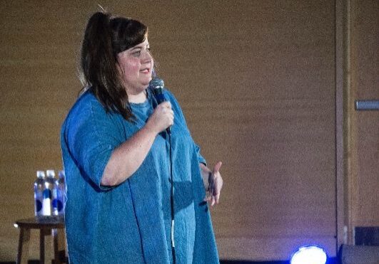 Stand-up comedy show with spotlight ambiance
