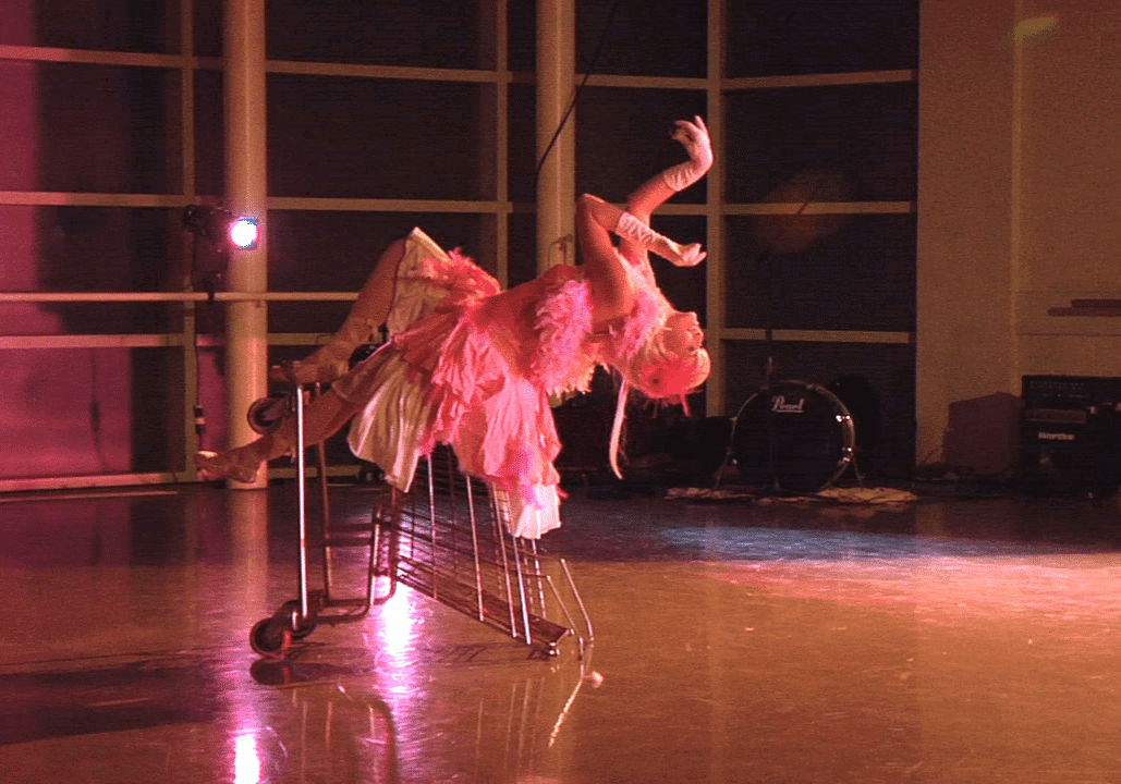Creative stage act with vibrant pink attire