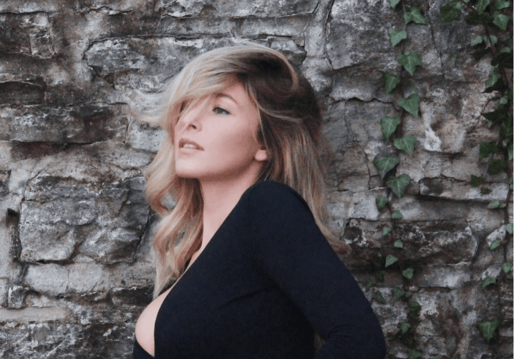 Stylish woman with ivy background