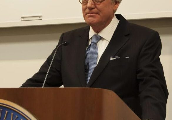 Man speaking at a podium
