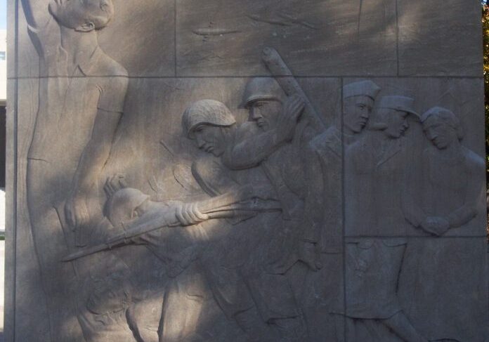 War scene stone sculpture