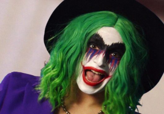 Smiling clown with colorful makeup