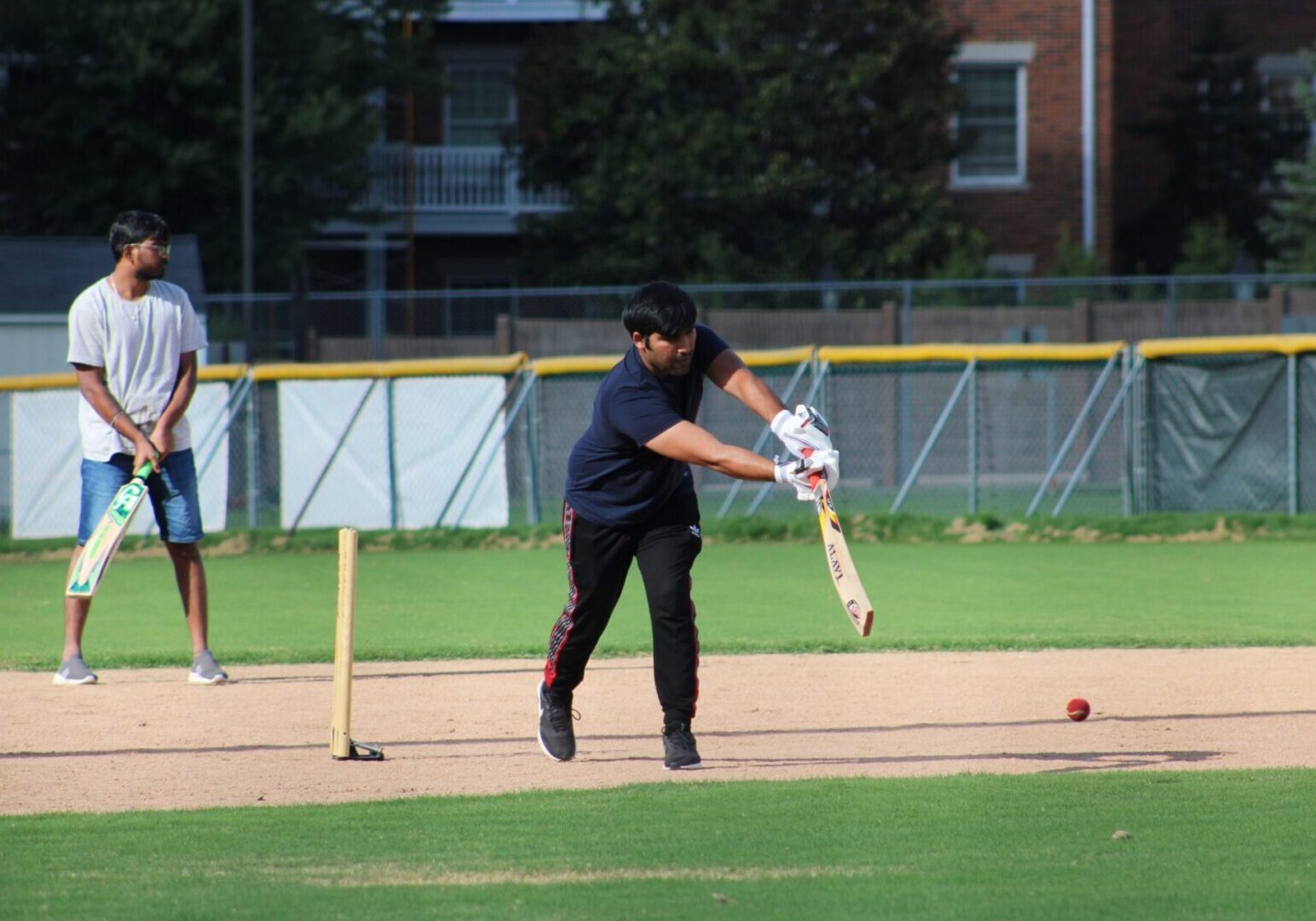 Batsman striking a cricket ball