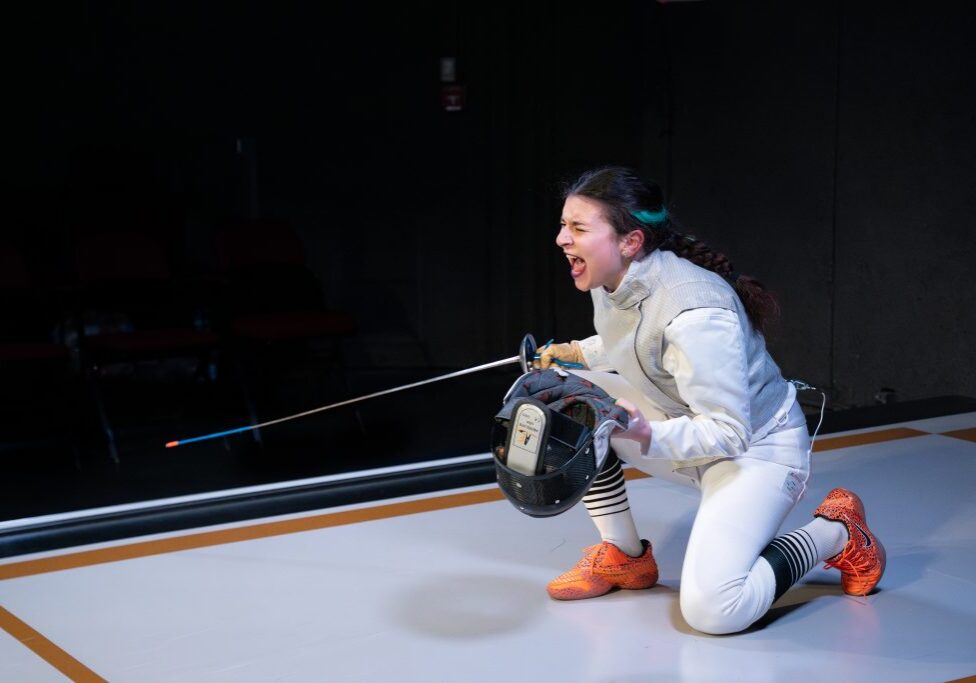 Fencer celebrating victory on the piste