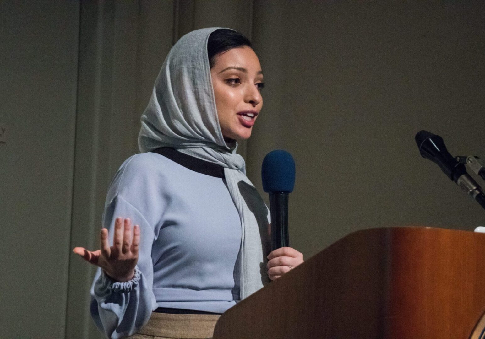 Woman delivering a speech in a hijab
