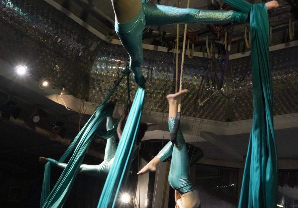 Acrobats suspended in mid-air performance