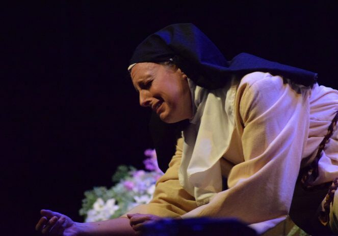 Nun in emotional stage performance
