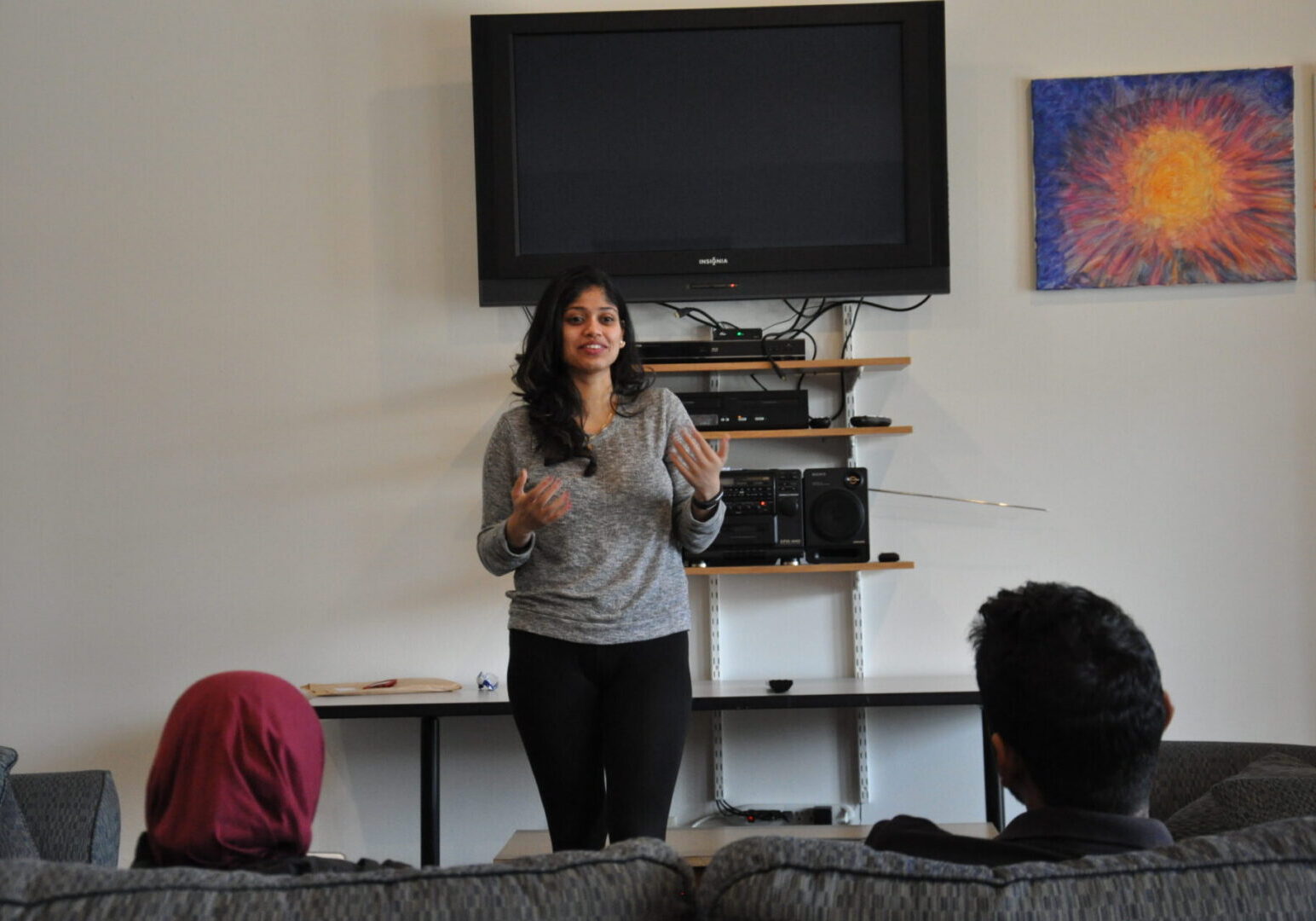 Woman giving presentation in living room