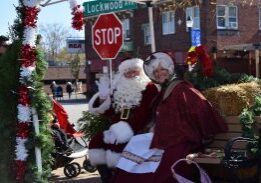 Santa and Mrs. Claus on decorated bench