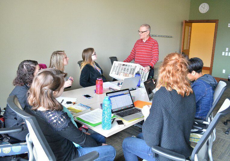 Meeting discussion around a conference table