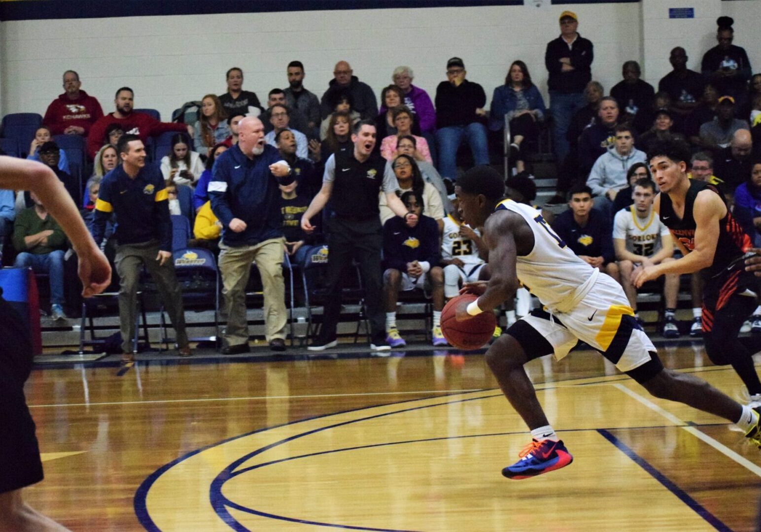 Athlete drives ball on court